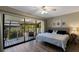 Main bedroom with king-size bed and sliding doors leading to private balcony at 1759 Dawn St # 308, Sarasota, FL 34231