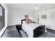 Bedroom with a ceiling fan, window, and bedside tables at 2124 N Tamiami Trl # 103, Sarasota, FL 34234