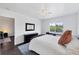 Bedroom with a ceiling fan, window, and bedside tables at 2124 N Tamiami Trl # 103, Sarasota, FL 34234