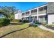 Well-maintained condo building with screened patios and landscaping, offering a desirable residential setting at 2124 N Tamiami Trl # 103, Sarasota, FL 34234