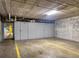 Clean and organized storage garage with concrete flooring and storage units along the back wall at 2124 N Tamiami Trl # 103, Sarasota, FL 34234