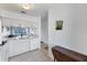 Bright kitchen with tile floors and a view to the living room at 2124 N Tamiami Trl # 103, Sarasota, FL 34234