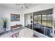 Inviting lanai with seating and artwork, connecting indoor and outdoor living spaces at 2124 N Tamiami Trl # 103, Sarasota, FL 34234