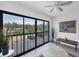 Lanai with seating, offering a serene outdoor living area with a view of the property at 2124 N Tamiami Trl # 103, Sarasota, FL 34234