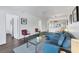 Spacious living room with access to kitchen and hallway areas, offering seamless flow and comfortable living space at 2124 N Tamiami Trl # 103, Sarasota, FL 34234