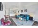 Inviting living area showcasing a modern kitchen, comfortable seating, and natural light for a relaxed atmosphere at 2124 N Tamiami Trl # 103, Sarasota, FL 34234