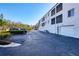 Exterior view of parking lot and the building, offering convenient and accessible parking for residents and visitors at 2124 N Tamiami Trl # 103, Sarasota, FL 34234