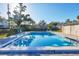 Inviting community pool surrounded by lush landscaping, offering a refreshing and relaxing atmosphere for residents at 2124 N Tamiami Trl # 103, Sarasota, FL 34234