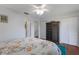 Bedroom with floral bedding and ample closet space at 3304 Ramblewood Pl, Sarasota, FL 34237