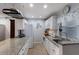 Bright kitchen with white cabinets, granite counters, and stainless steel appliances at 3304 Ramblewood Pl, Sarasota, FL 34237