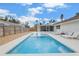 Relaxing backyard pool with lounge chairs and a screened patio at 3507 68Th W St, Bradenton, FL 34209