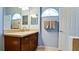 Bathroom with a vanity, neutral color scheme, and arched window at 4046 Overture Cir # 4046, Bradenton, FL 34209