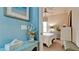 View into a bedroom with a teal wall and white bedding at 4046 Overture Cir # 4046, Bradenton, FL 34209
