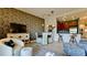 Charming dining area with leaf patterned wall and kitchen access at 4046 Overture Cir # 4046, Bradenton, FL 34209
