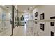 Long hallway with white railings and large framed art at 4046 Overture Cir # 4046, Bradenton, FL 34209