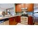 Stainless steel appliances and wood cabinets in this kitchen at 4046 Overture Cir # 4046, Bradenton, FL 34209