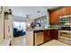 Open kitchen features stainless steel appliances and wood cabinets at 4046 Overture Cir # 4046, Bradenton, FL 34209