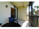 Relaxing screened balcony with outdoor seating and lake view at 4046 Overture Cir # 4046, Bradenton, FL 34209