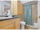 Updated bathroom with wood cabinets and a shower/tub combo at 4255 Gulf Dr # 116, Holmes Beach, FL 34217