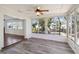 Sunroom with wood-look floors and ceiling fan at 4301 Teakwood Cir, Bradenton, FL 34208