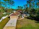 Aerial view of the single-story home, front yard, and driveway at 4344 Eldron Ave, North Port, FL 34286