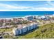 Aerial view of condo building near beach, showcasing oceanfront location at 4540 Gulf Of Mexico Dr # 204, Longboat Key, FL 34228