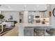 Modern kitchen with a large island, white cabinets, and stainless steel appliances at 4735 Motta Ct, Bradenton, FL 34211