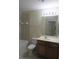 Clean bathroom with a single sink vanity, toilet, and bathtub at 4850 51St W St # 8104, Bradenton, FL 34210