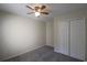 Spacious bedroom with ceiling fan, carpet, and double-door closet at 4850 51St W St # 8104, Bradenton, FL 34210
