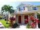 Two-story townhome with red doors and landscaping at 4850 51St W St # 8104, Bradenton, FL 34210