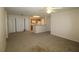 Living room with carpet and kitchen access at 4850 51St W St # 8104, Bradenton, FL 34210