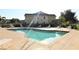 Community swimming pool with lounge chairs and patio area at 4850 51St W St # 8104, Bradenton, FL 34210