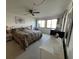 Spacious bedroom with king-size bed and water view at 5171 Willow Links # 23, Sarasota, FL 34235