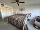 King-size bed in bright bedroom at 5171 Willow Links # 23, Sarasota, FL 34235