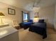 Cozy guest bedroom featuring two twin beds and ceiling fan at 5171 Willow Links # 23, Sarasota, FL 34235