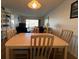 Bright dining area with wood flooring and seating for four at 5171 Willow Links # 23, Sarasota, FL 34235