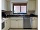 Well-equipped kitchen with granite countertops and stainless steel dishwasher at 5171 Willow Links # 23, Sarasota, FL 34235