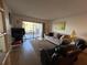 Spacious living room with patio access and comfortable seating at 5171 Willow Links # 23, Sarasota, FL 34235