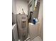 Water heater and air conditioning unit in the mechanical room at 5171 Willow Links # 23, Sarasota, FL 34235