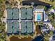 Aerial view of community tennis courts and pool at 5259 Heron Way # 103, Sarasota, FL 34231