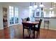 Dining area with french doors, hardwood floors, and a view of the kitchen at 5613 Key Largo Ct, Bradenton, FL 34203