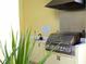 Outdoor grill area with stainless steel grill at 5613 Key Largo Ct, Bradenton, FL 34203