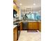 Kitchen with breakfast bar and stainless steel appliances, open to the living room at 5613 Key Largo Ct, Bradenton, FL 34203