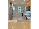 Kitchen features stainless steel appliances, wood cabinets, and light countertops at 5613 Key Largo Ct, Bradenton, FL 34203
