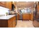 Modern kitchen featuring stainless steel appliances, granite countertops, and ample cabinet space at 5613 Key Largo Ct, Bradenton, FL 34203