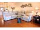 Living room with sectional couch and wood floors at 5613 Key Largo Ct, Bradenton, FL 34203