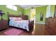 Primary bedroom with ensuite access and wood furniture at 5613 Key Largo Ct, Bradenton, FL 34203
