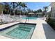 Community pool and spa with lounge chairs at 5613 Key Largo Ct, Bradenton, FL 34203