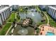 Aerial view of resort-style condo community with ponds, bridges and walkways at 5780 Midnight Pass Rd # 205, Sarasota, FL 34242