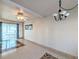 Bright dining room with tile floors and a chandelier at 5889 Garden Ln # H4, Bradenton, FL 34207